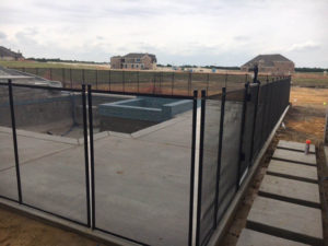 Black removable safety fence for a new pool in Parker, TX