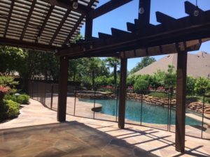 Bronze pool safety gate for this gorgeous pool in Keller, TX