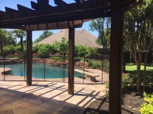 Bronze pool safety gate for this gorgeous pool in Keller, TX